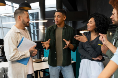 The scene shows a team interacting in a work environment, reinforcing that communication, active listening, and collaboration are essential skills in software development.
